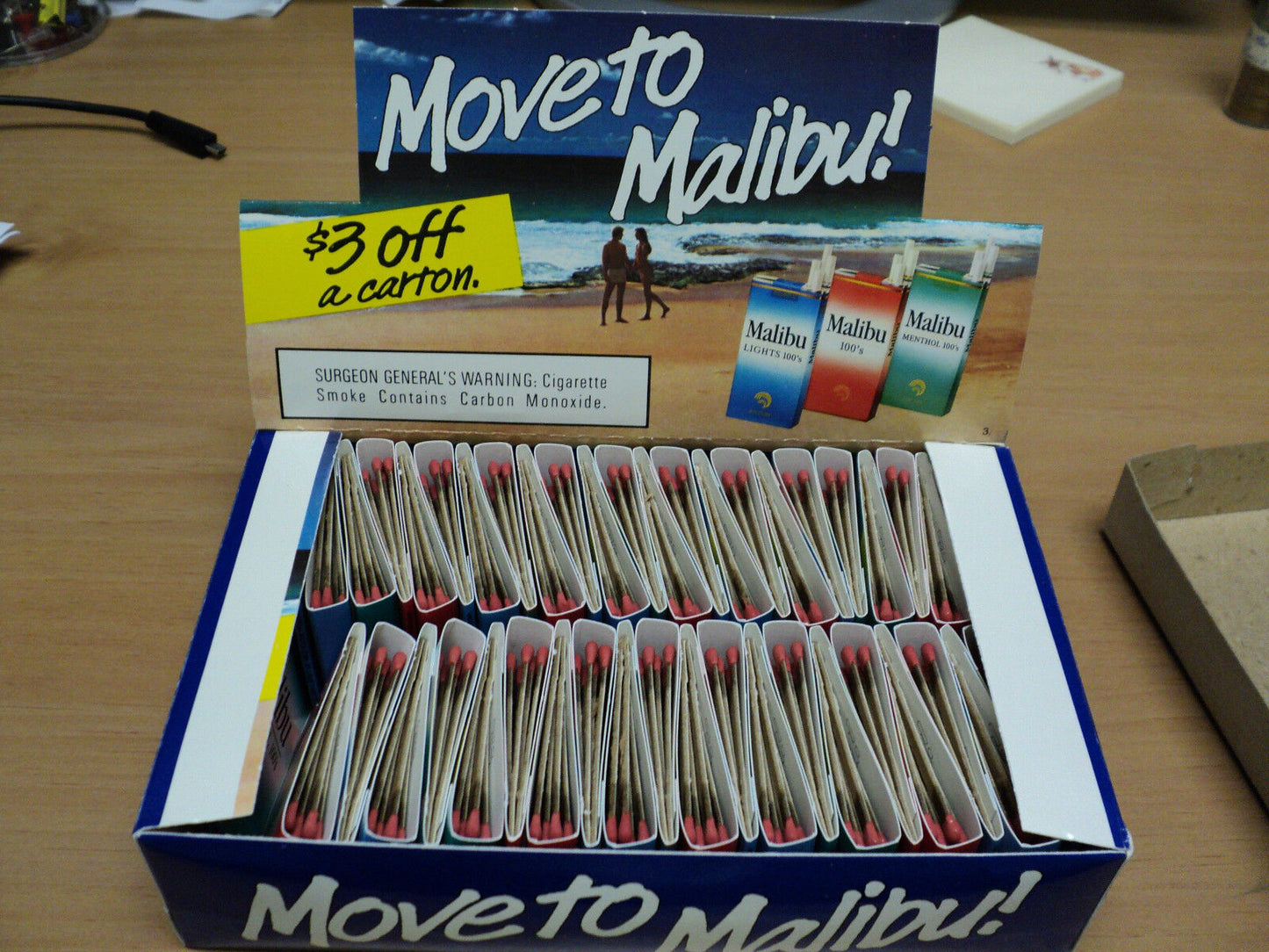 Box Counter Display With  47 Malibu Cigarette matchbooks.